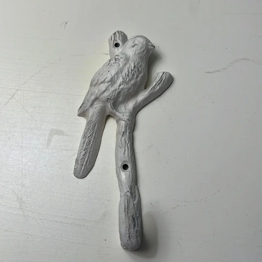 Bird and branch coat hook.